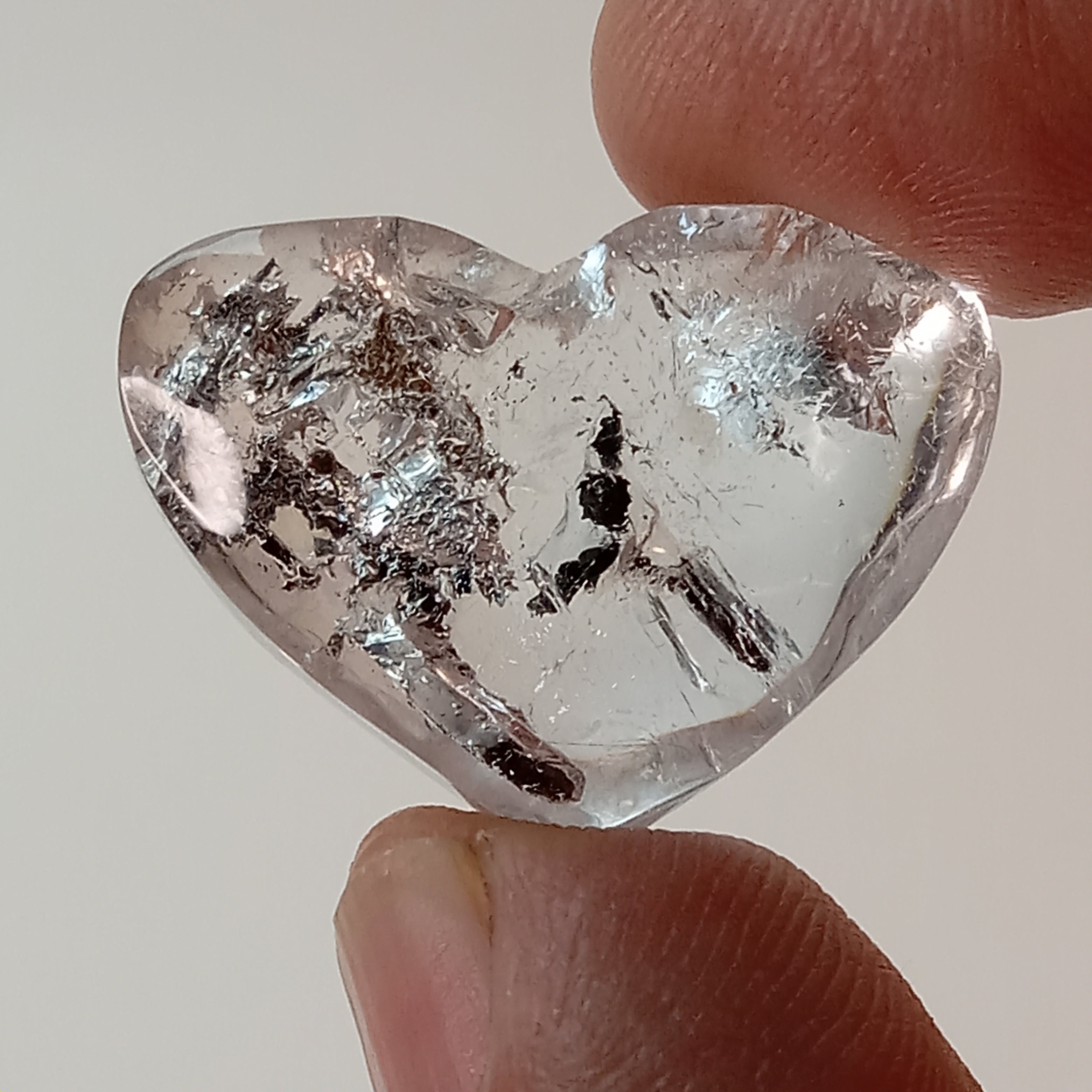 Clear Enhydro Quartz Heart with Moving Carbon Bubble and Floating Sand
