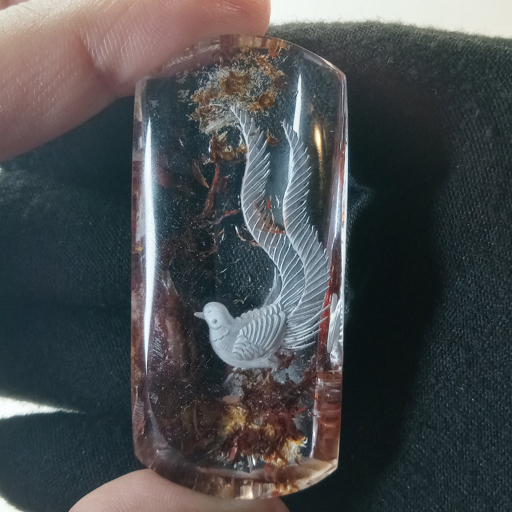 Bird Carving Suspended Inside Hematoid Quartz